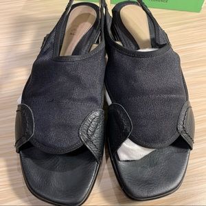 Black, open-toe thick sole sling.